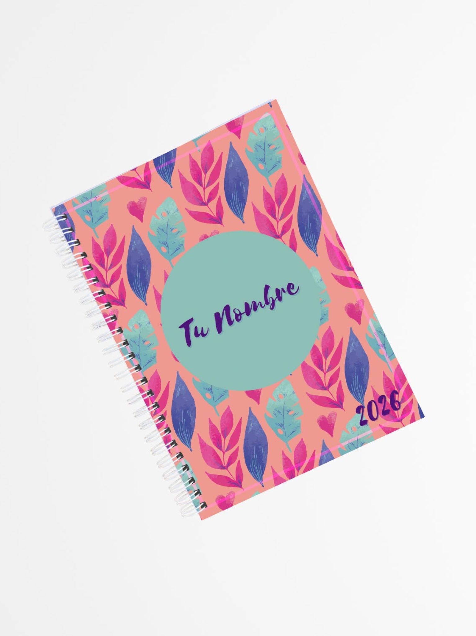 portada de agenda personalizada 2026 con diseño de hojas en tonos fucsia, azul y coral, encuadernada en espiral blanca