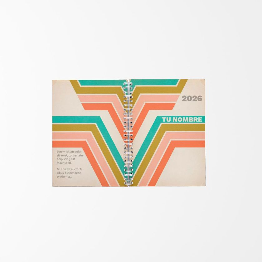 agenda abierta con diseño vintage en tonos verde, coral y dorado, encuadernada con espiral central y fondo blanco