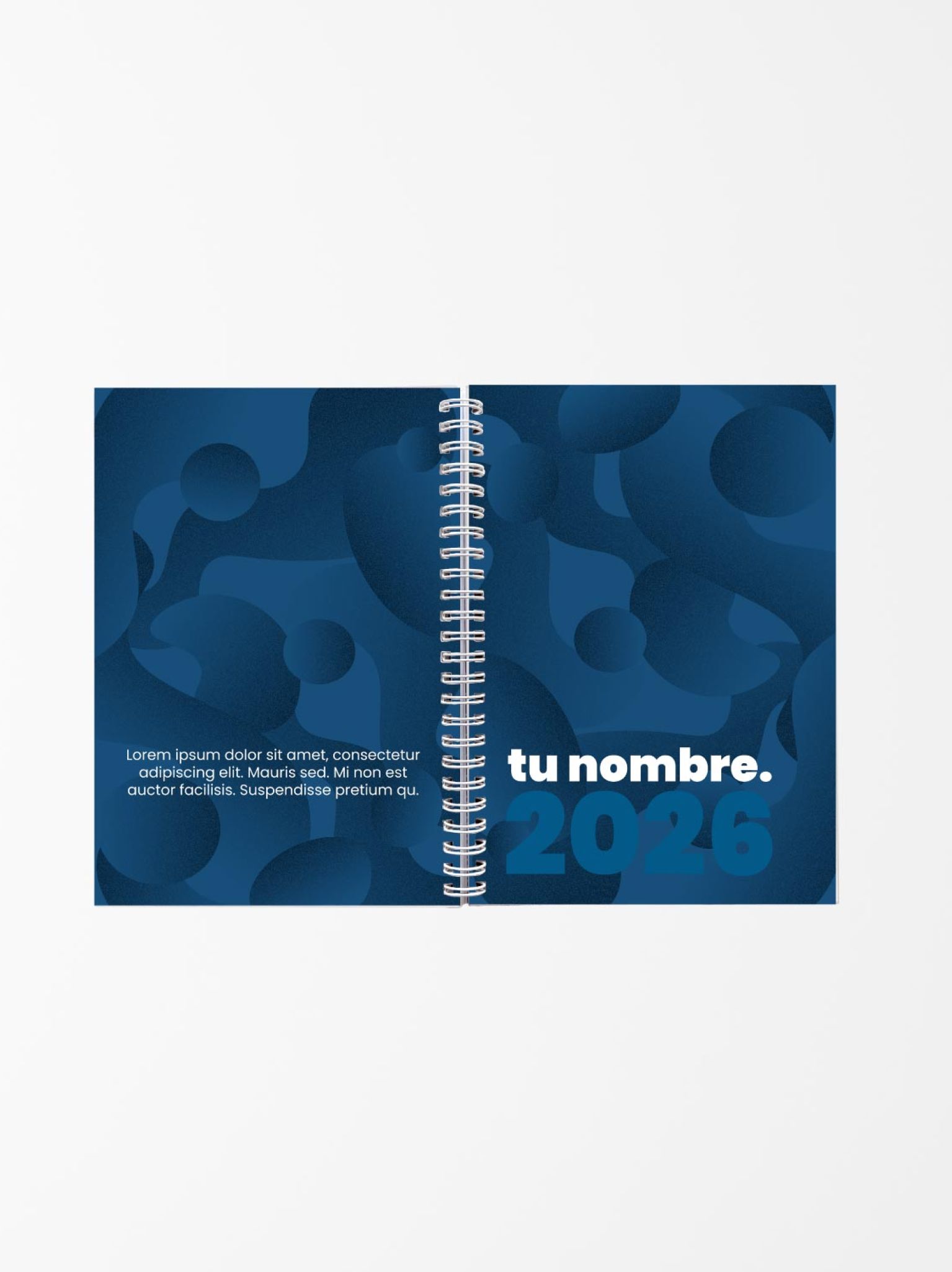 vista abierta de agenda personalizada con fondo azul abstracto y texto &ldquo;tu nombre 2026&rdquo;, encuadernada con espiral blanca