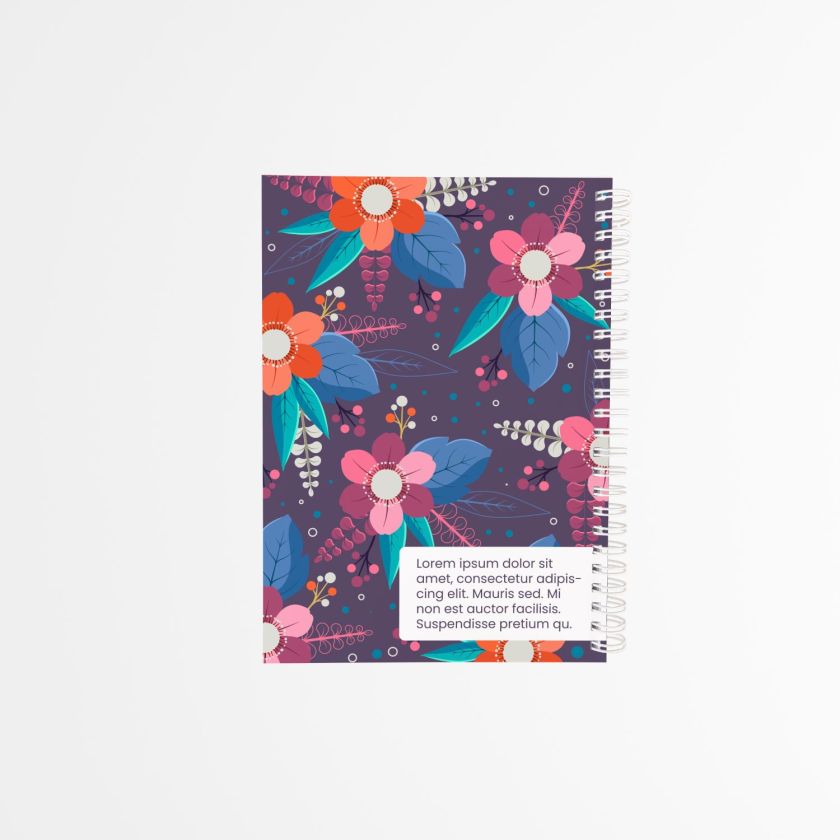 contraportada de agenda personalizada con estampado de flores en tonos vivos sobre fondo morado, con encuadernado blanco en espiral