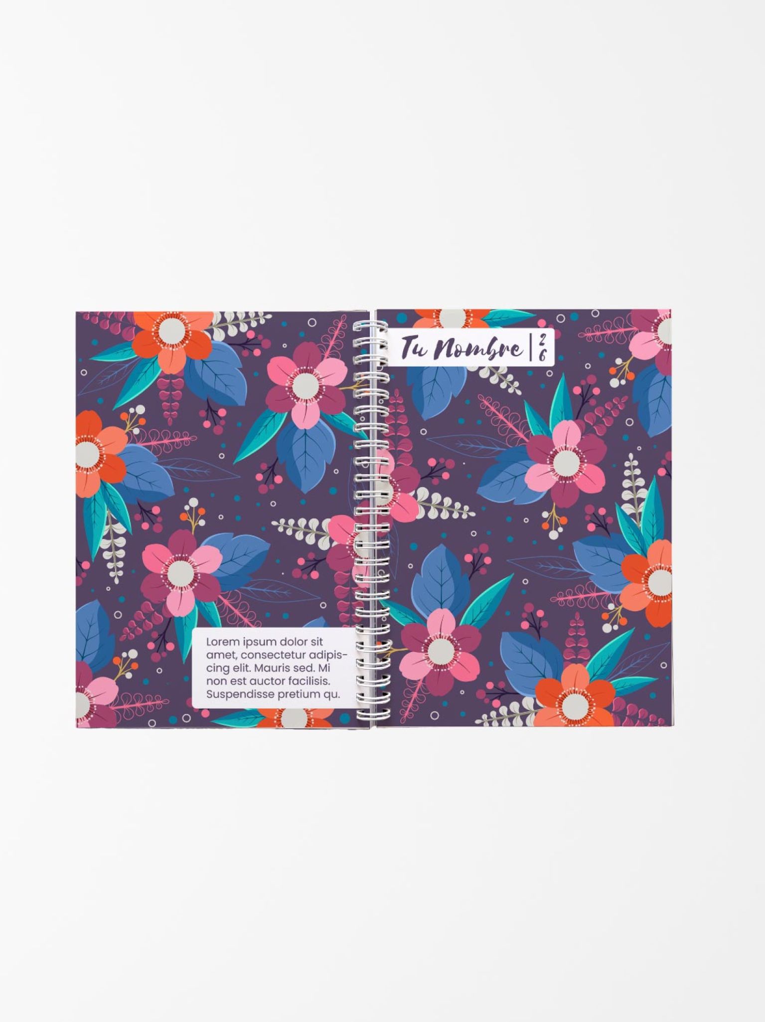 vista abierta de una agenda personalizada con fondo morado y estampado floral en tonos fucsia, azul y naranja, encuadernada con espiral blanca