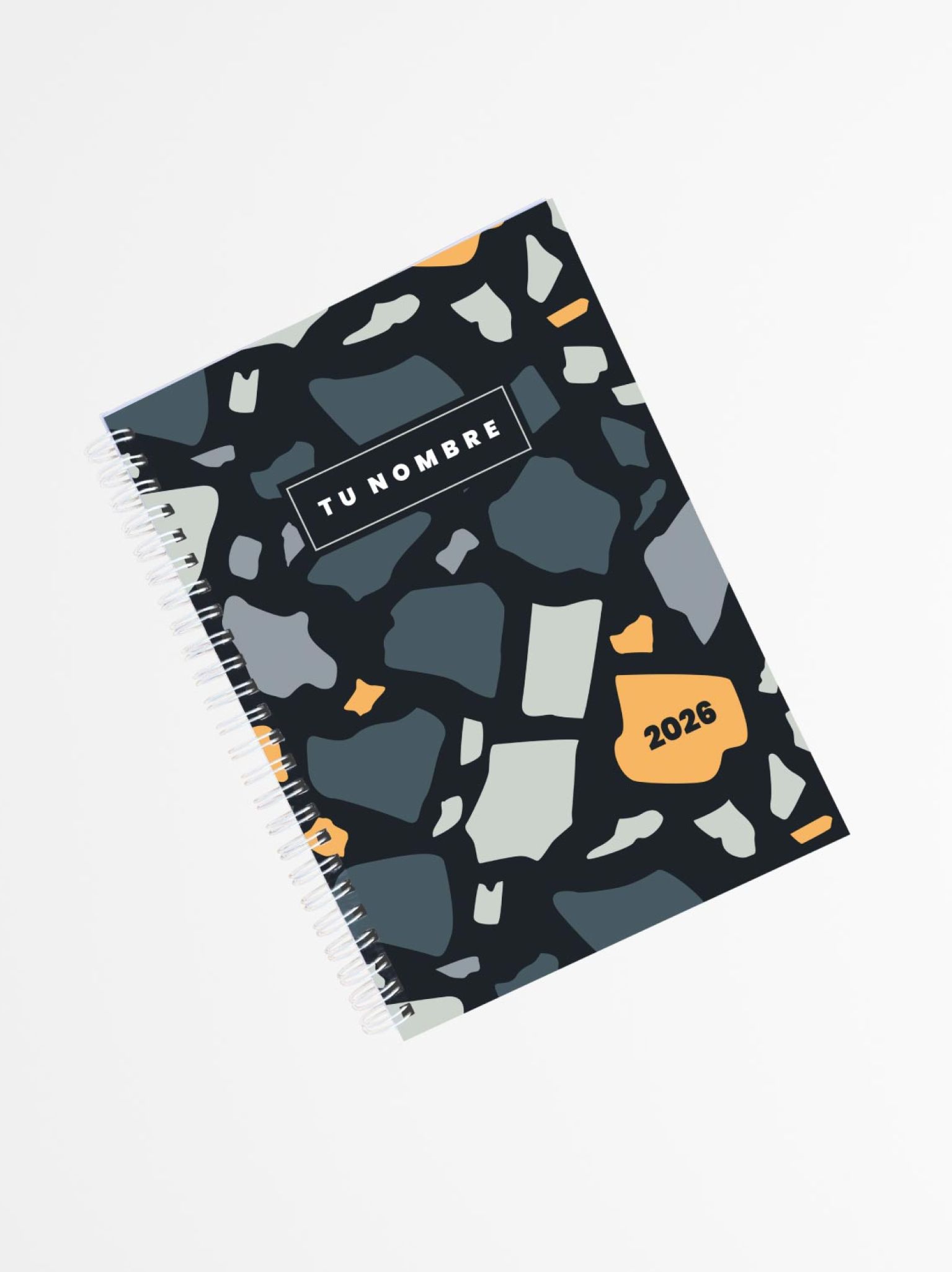 portada de agenda personalizada 2026 con patr&oacute;n terrazzo en tonos grises, azules y naranjas, encuadernaci&oacute;n en espiral blanca
